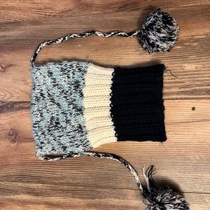 Knit hat with pom poms